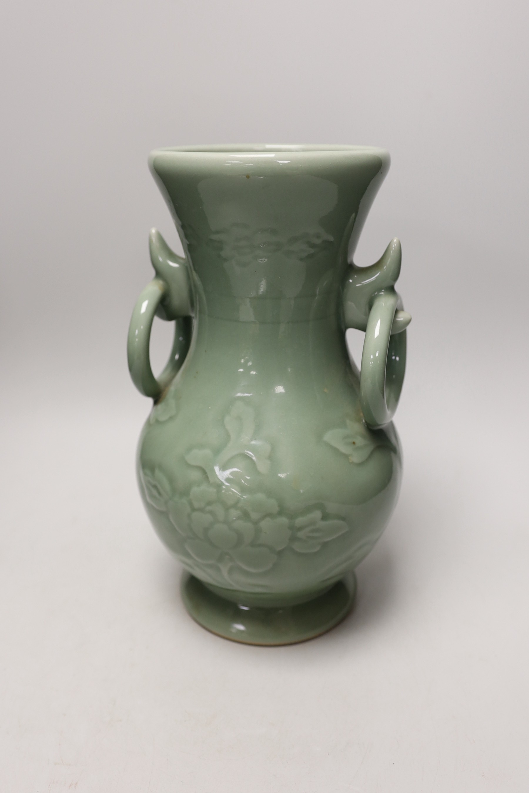 A two handled Chinese celadon glazed vase. 32cm tall